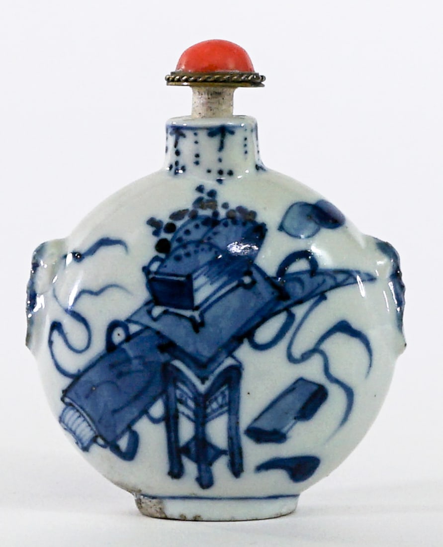 Chinese Blue and White Porcelain Snuff Bottle: Chinese blue and white porcelain scenic snuff bottle with coral snuff spoon stopper signed underside measures 3 in. tall x 2.5 in. wide x 1 in. deep. Note the bottom rim with very light chips and