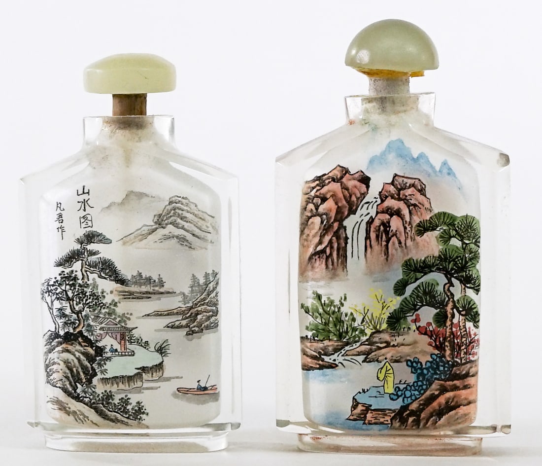 Pair Inside Painted Snuff Bottles [Scenic}: Pair inside painted snuff bottles. Note one stopper broken at neck. Each measures 3.125 in. tall x 1.75 in. wide x .75 in. deep. Lot measures 3.125 in. H x 3.5 in. W x .75 in. D for shipping purposes
