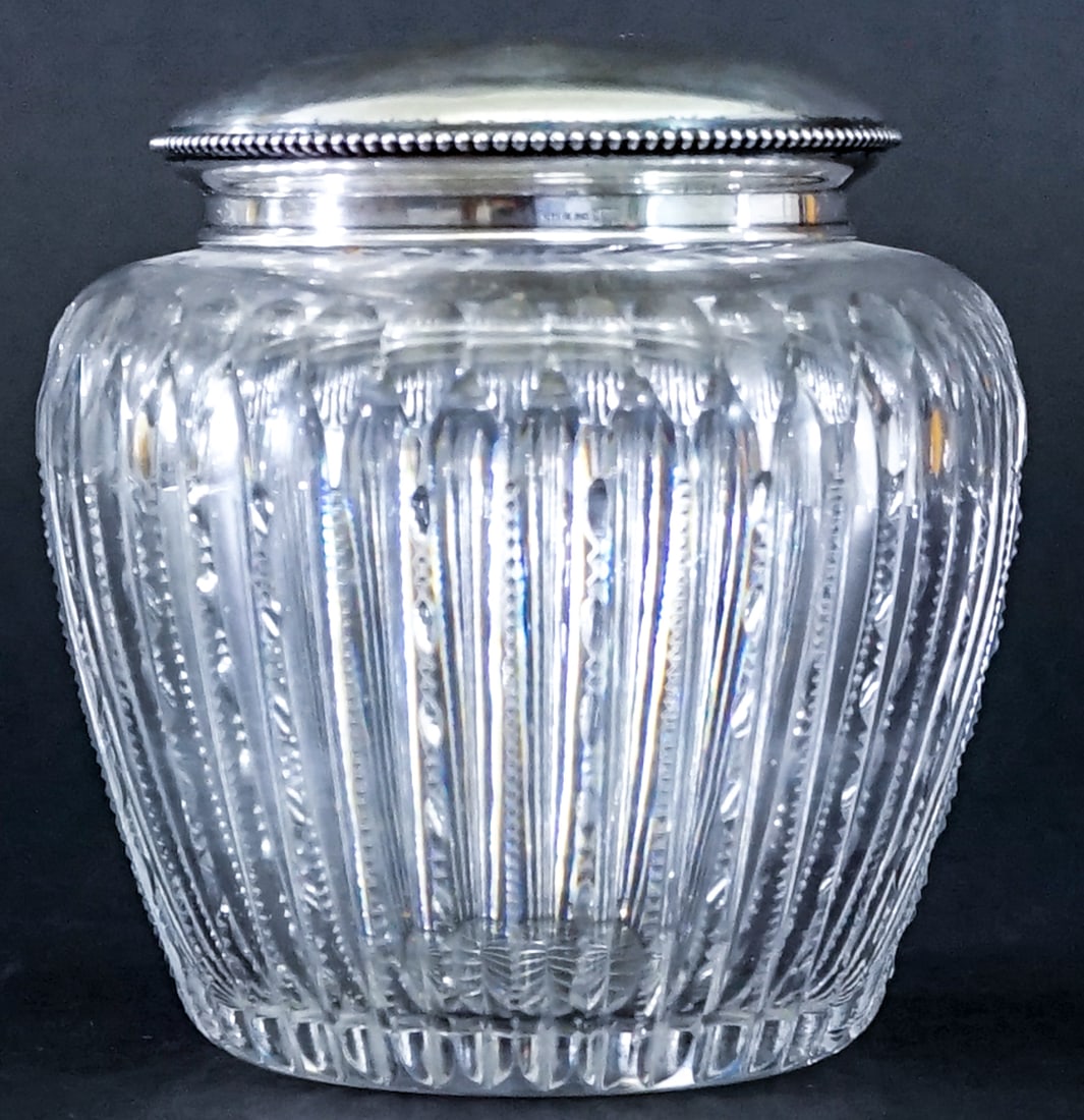 5.5IN Sterling Lidded Cut Crystal Jar 60g: Sterling lidded crystal jar measures 5.5 in. tall x 5 in. diameter. Sterling lid weighs 60 grams. No evident cracks, chips or repairs. Lot measures 5.5 in. H x 5 in. W x 5 in. D for shipping purposes 
