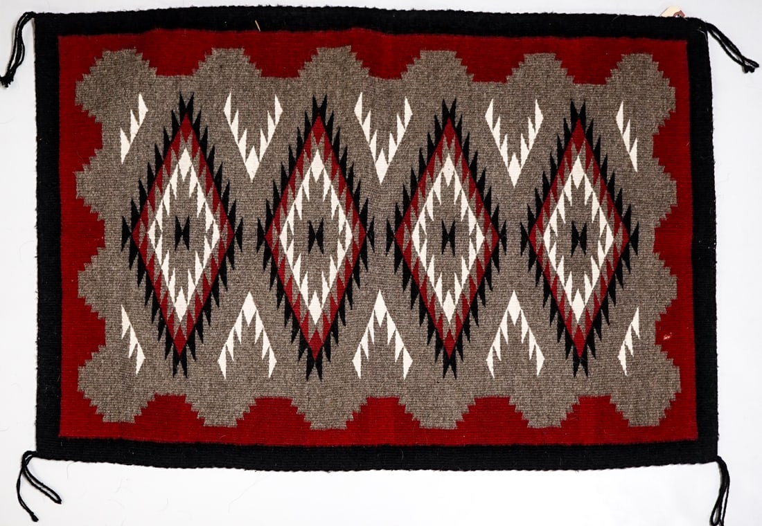 Irene Yazzie Navajo Rug: Measures 24.5 x 35.5 inches. Excellent condition. The absence of a condition report does not imply that the lot is in perfect condition or completely free from wear and tear, imperfections, or the
