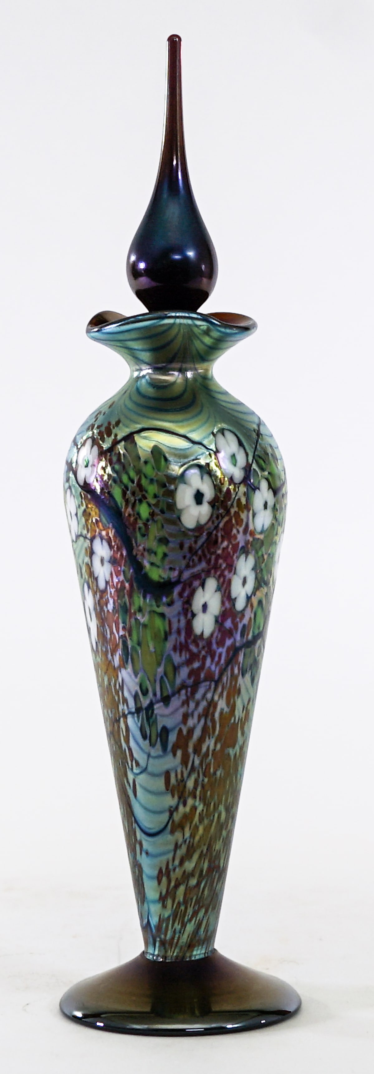 Okra Art Glass Studio Hand Blown 10IN Bottle: Okra Glass Studio glass vase with stopper. Includes original box. Box measures 11 x 4 x 4 in. No evident cracks, chips or repairs. Lot measures 11 in. H x 4 in. W x 4 in. D for shipping purposes only.