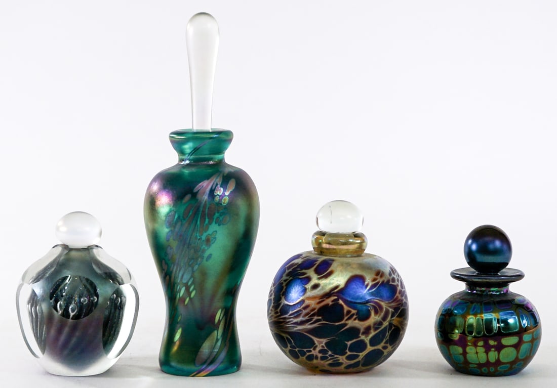 Art Glass (4) Perfume Bottles [Maytum; Mueller]: Four (4) Artist signed perfume bottles. Susan Mueller; Brian Maytum; Stuart Abelman and other. Measure with stoppers 3 to 7.5 in. tall x 2 to 2.75 in. diameter. No evident cracks, chips or repairs. Lo