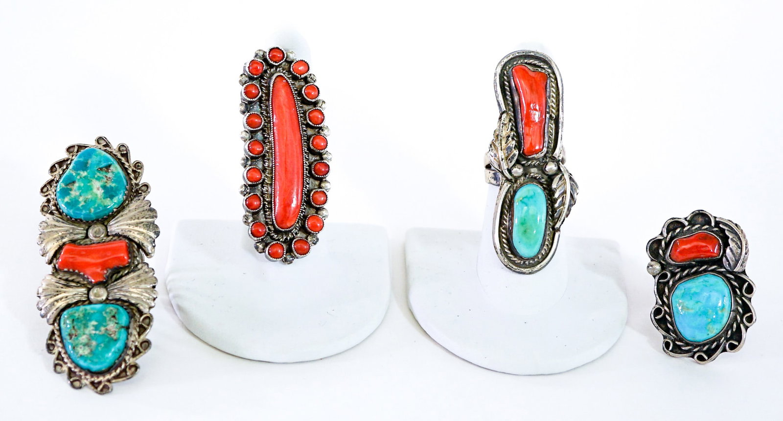 Southwest -Style (4) Rings [Coral; Turquoise] 62g: Ring sizes measure 5.5 to 7. Lot measures 3.5 in. H x 3.5 in. W x 1.5 in. D for shipping purposes only. The absence of a condition report does not imply that the lot is in perfect condition or complet