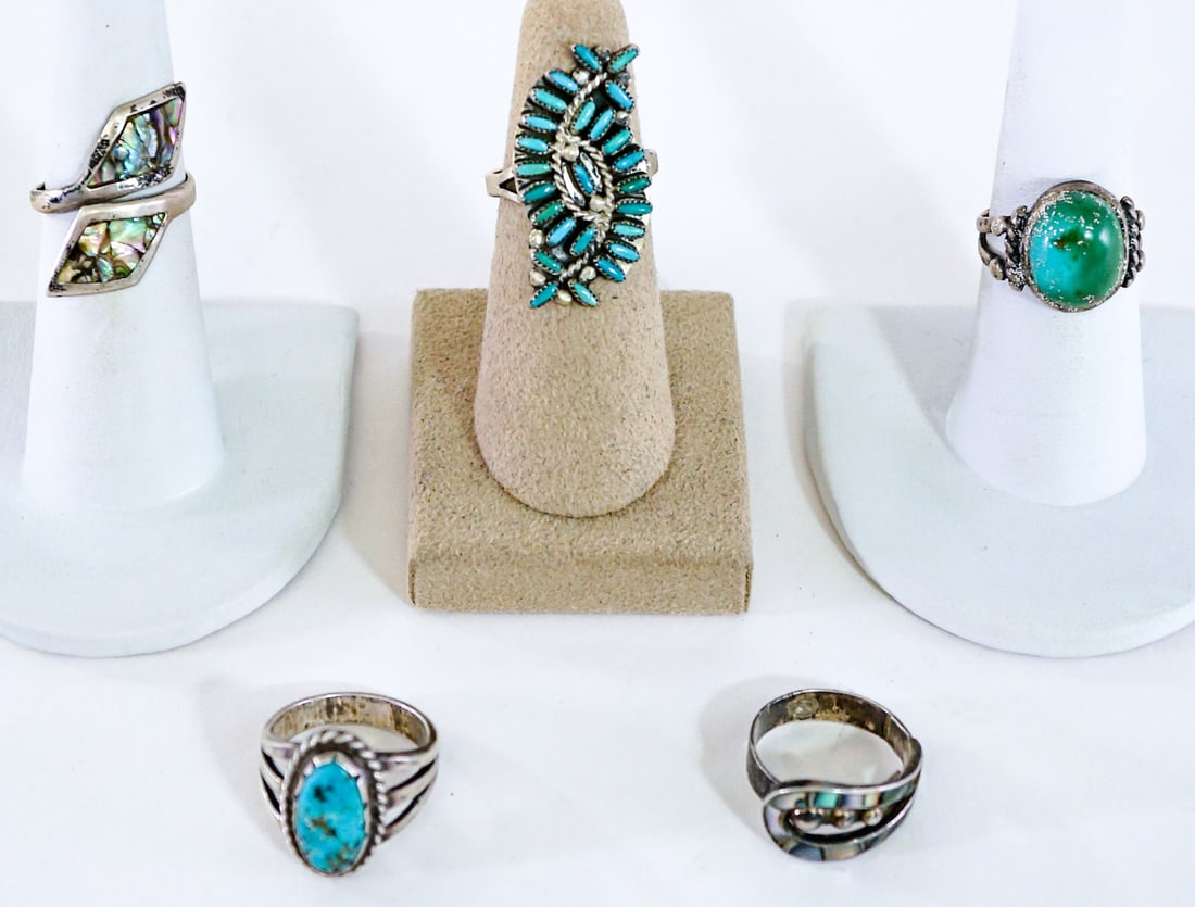 Assorted Stone (5) Rings [MOP; Turquoise]: Ring sizes measure 5.5 to 7. Lot measures 3.5 in. H x 3.5 in. W x 1.5 in. D for shipping purposes only. The absence of a condition report does not imply that the lot is in perfect condition or complet