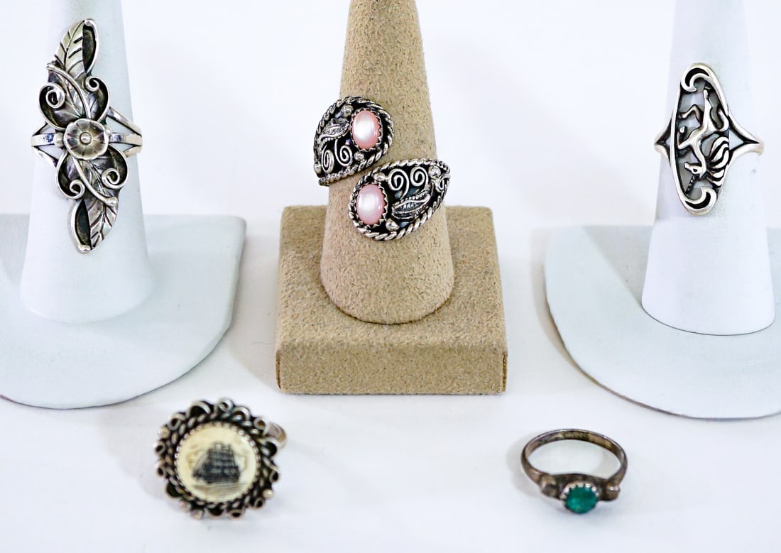 Southwest-Style (5) Rings 20g: Ring sizes measure 4.5 to 7. Lot measures 3.5 in. H x 3.5 in. W x 1.5 in. D for shipping purposes only. The absence of a condition report does not imply that the lot is in perfect condition or complet