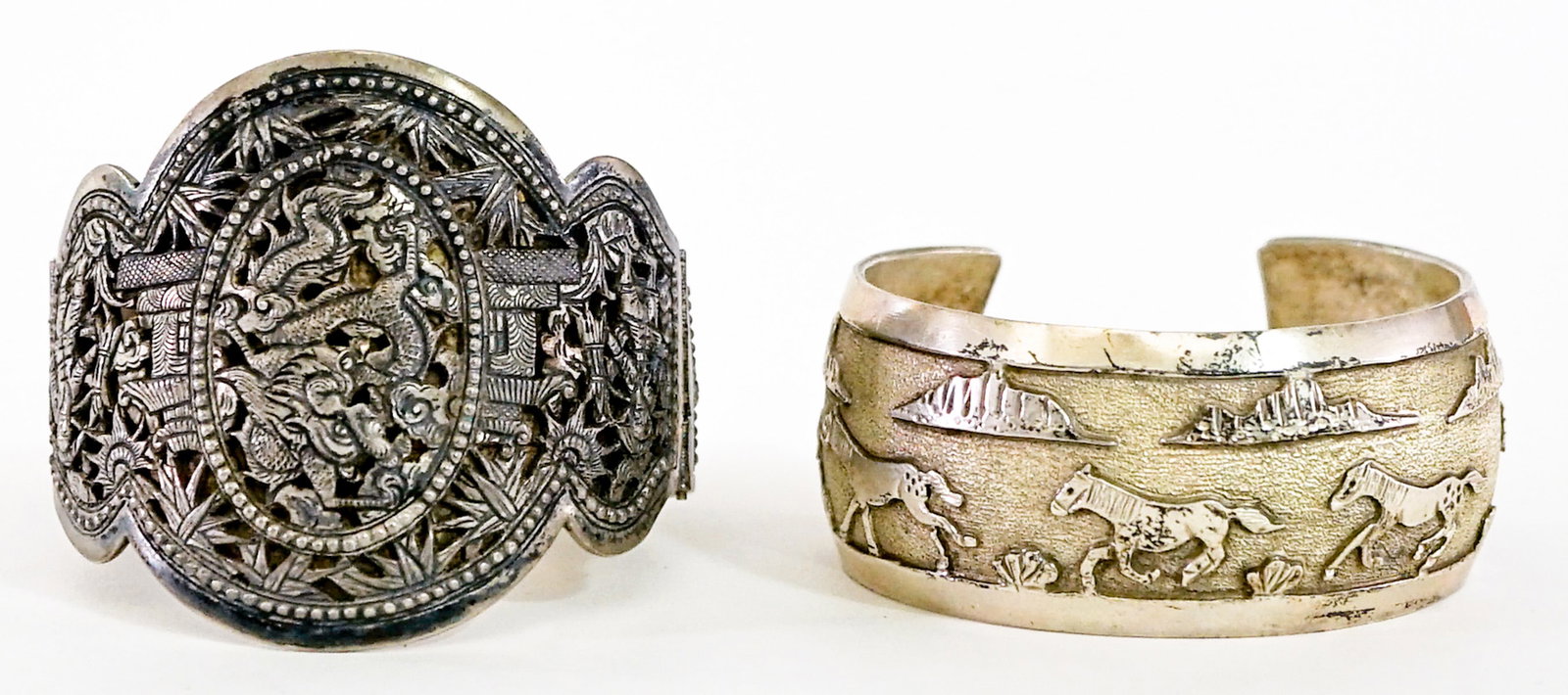 Southwest-Style (2) Bracelets 96g: Two (2) bracelets. Cuff bracelet measures 6.25 in.; clasp bracelet measures 7.5 in. note the clasp does not work. Lot measures 3.5 in. H x 3.5 in. W x 2.5 in. D for shipping purposes only. The