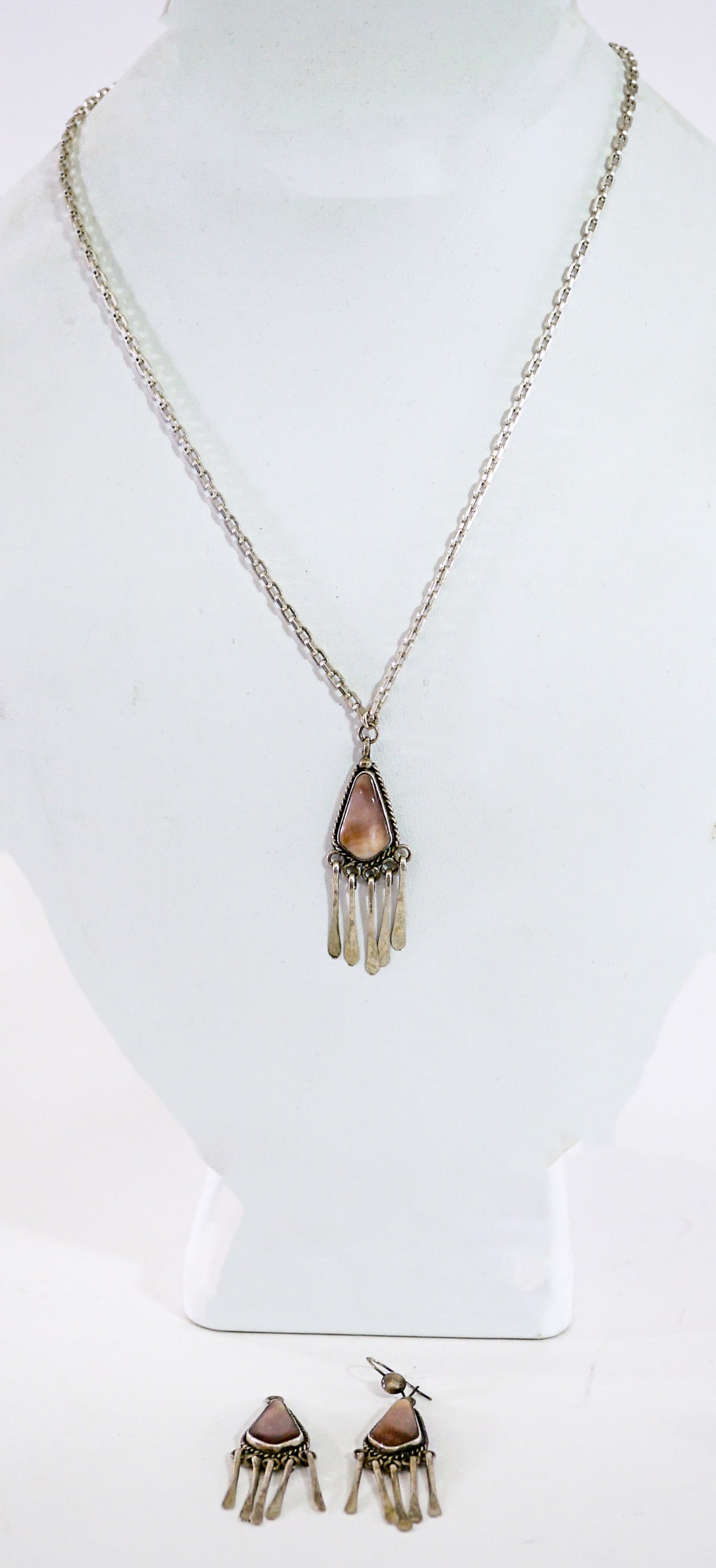 Southwest-Style Stone Pendant and Pair Earrings: Measure 1.5 in. x .5 in. The chain is marked sterling. Set weighs 16 grams. Note one of the earrings is lacking the fish hook. Lot measures 3.5 in. H x 3.5 in. W x 1.5 in. D for shipping purposes