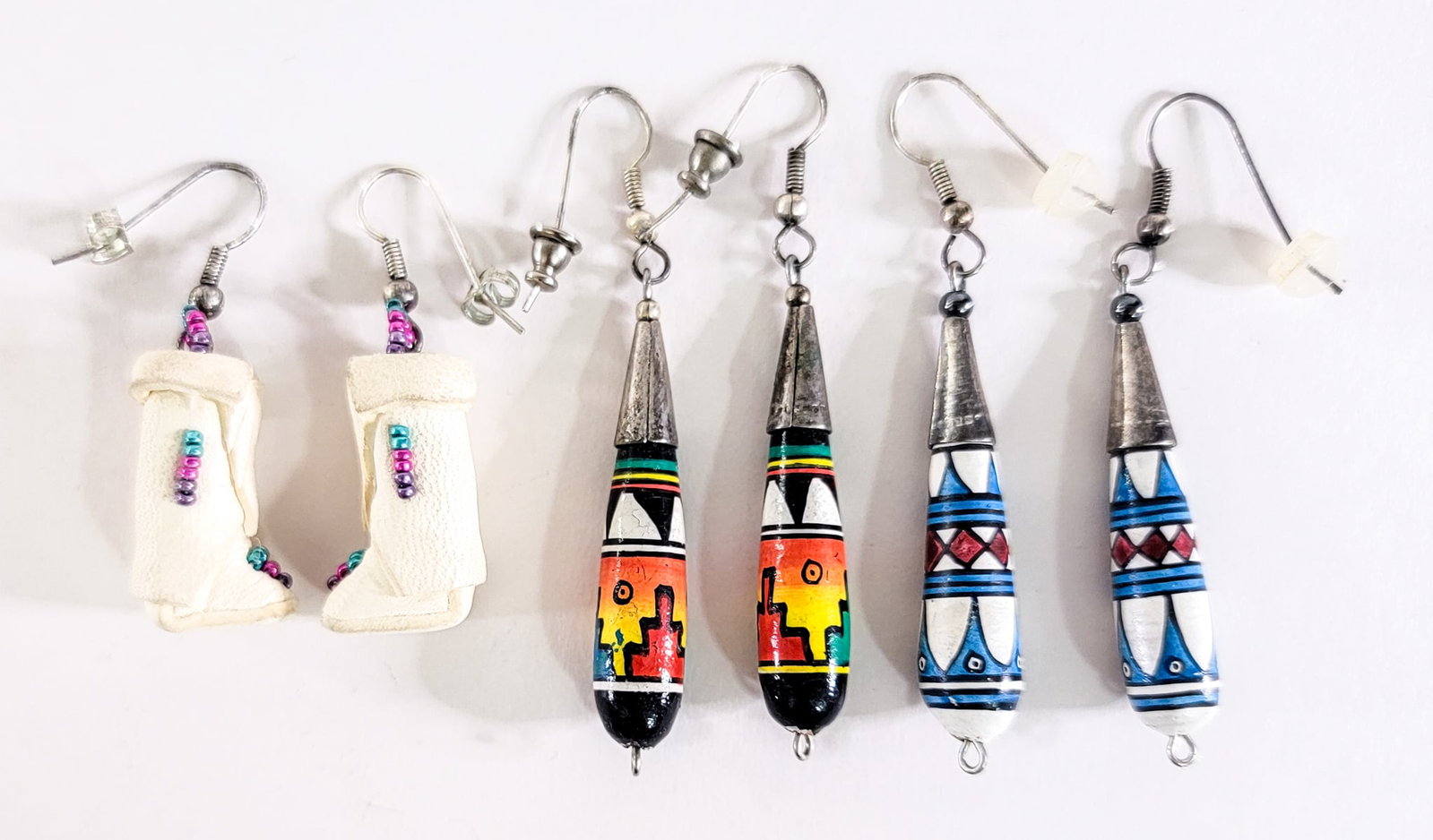 Southwest-Style (3PR) Earrings: Three (3) pair pierced earring sets measure 1.25 to 1.75 in. long. Lot measures 3.5 in. H x 3.5 in. W x 1.5 in. D for shipping purposes only. The absence of a condition report does not imply that the 