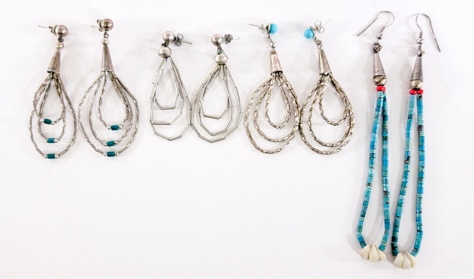 Southwest-Style (4PR) Earrings 18g: Four (4) pair pierced earring sets measure 2 to 4 in. long. Lot measures 3.5 in. H x 3.5 in. W x 1.5 in. D for shipping purposes only. The absence of a condition report does not imply that the lot is 