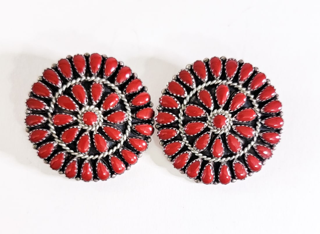 Kevin Yazzie Pair Sterling Earrings Coral Cluster: Navajo Kevin Yazzie sterling silver coral cluster stud earrings. Each measures 1.625 in. diameter. Weigh 20 grams. Lot measures 2 in. H x 2 in. W x 1.5 in. D for shipping purposes only. The absence of