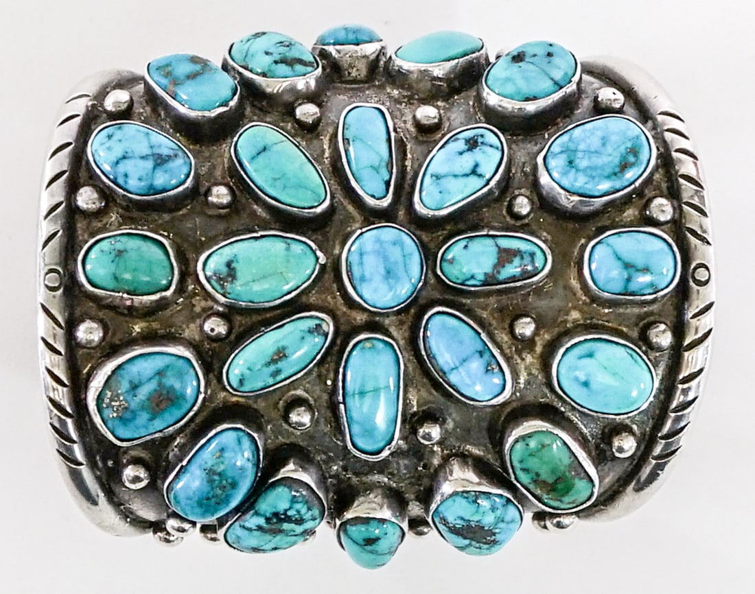 Silver and Turquoise Large Cuff Bracelet: [LARGE] Silver and turquoise cuff bracelet signed 'Yellow Bird' on verso. Outside measures 7.25 in. wide x 3.5 in. high. Inside circumference measures 5.9375 in. total 6.875 in. Weighs 200 grams. Lot 