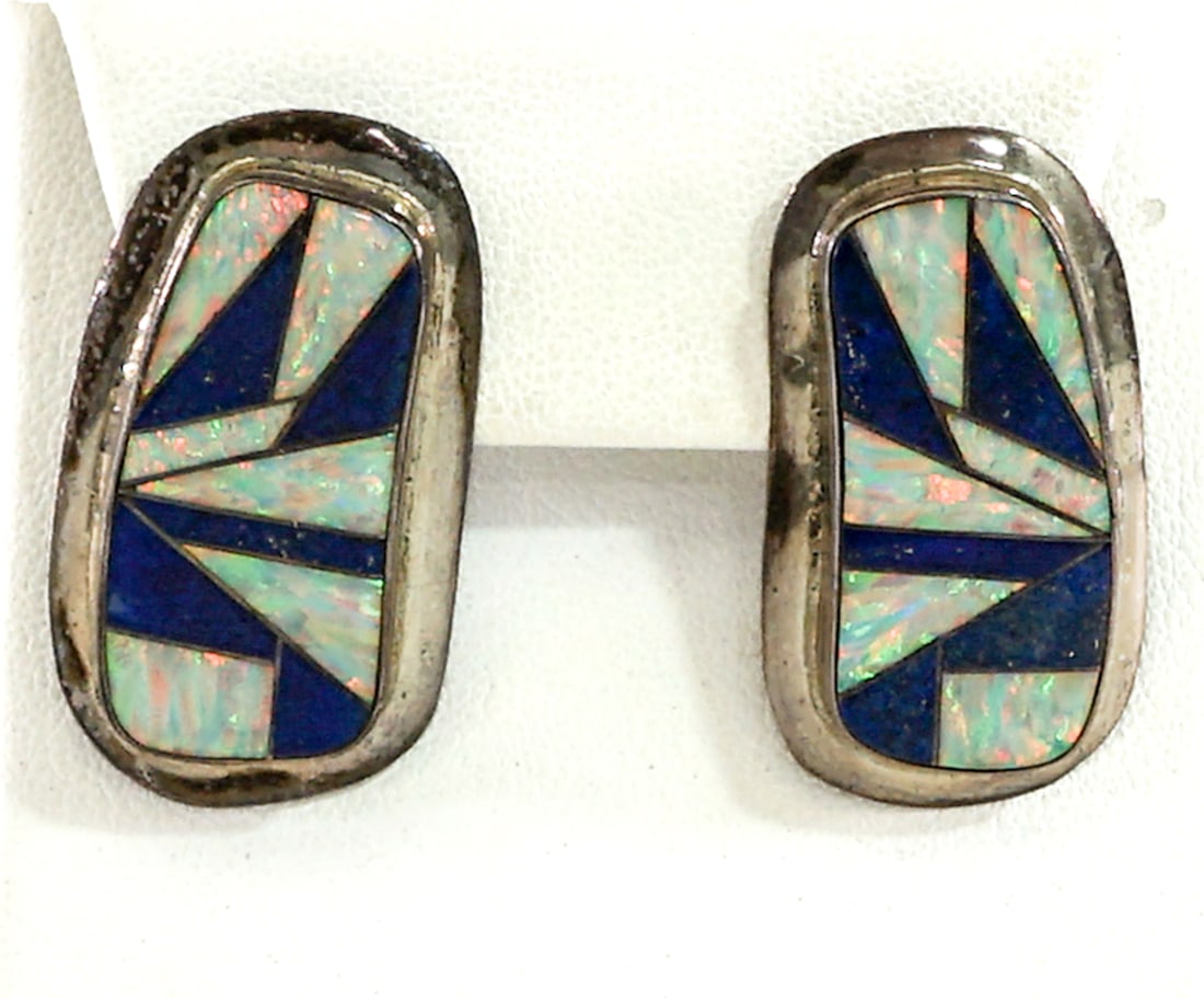 Picto Mark Pair Sterling Earrings: Picto Mark pair sterling inlaid pierced earrings measure 1.5 x .75 in. Weigh 14 grams. Lot measures 2 in. H x 2 in. W x 1.5 in. D for shipping purposes only. The absence of a condition report does not