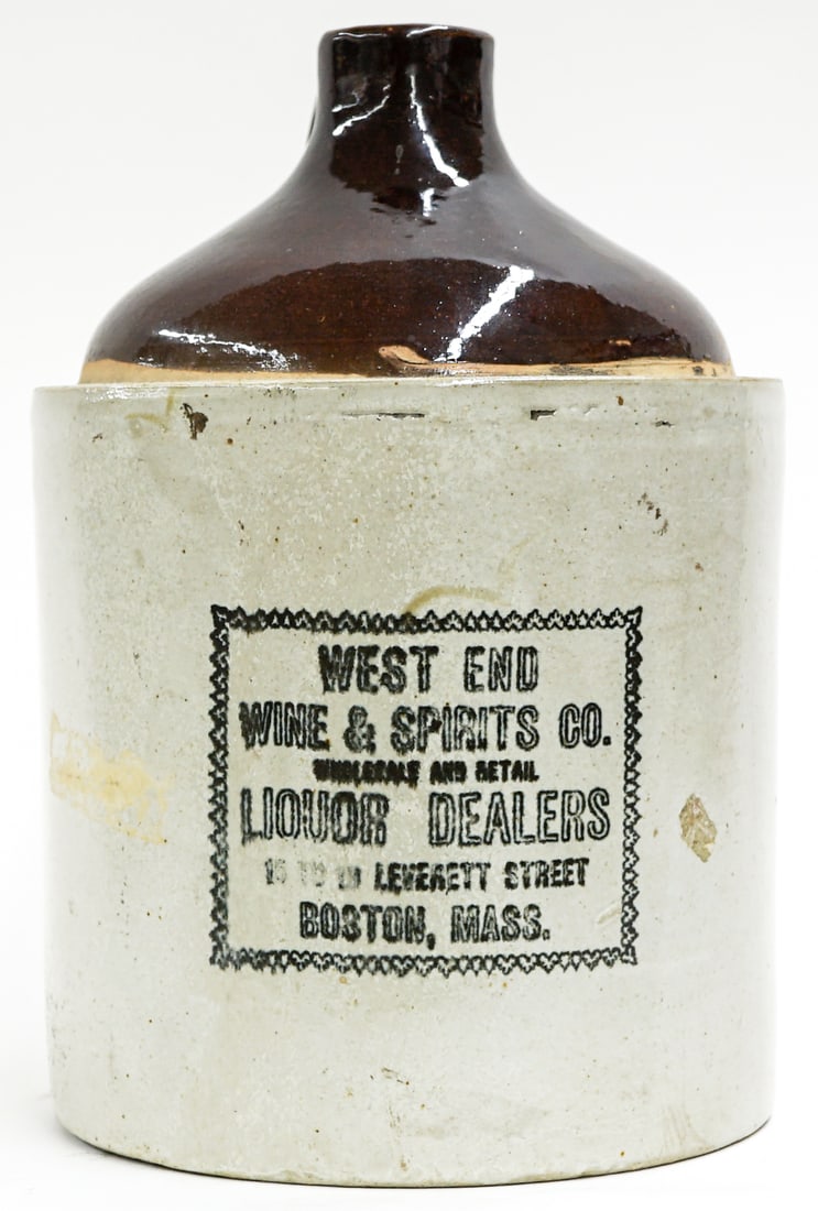 West End Wine (Boston) Jug: Measures 13 x 8.5 x 9.5 inches. There is one rough spot on edge of base and one chip on the top edge. The absence of a condition report does not imply that the lot is in perfect condition or