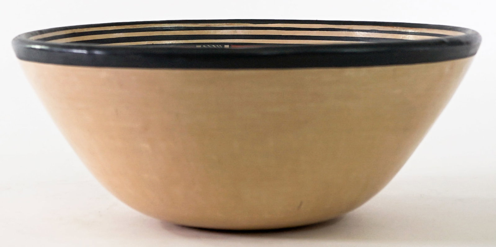 Gregorio Bracamonte SIGNED Polychrome Bowl: Gregario Bracamonte (Nicaraguan, 1949-2019) polychrome pottery bowl signed underside measures 9.75 in. across x 4 in. tall. No evident cracks, chips or repairs. Lot measures 4 in. H x 9.75 in. W x