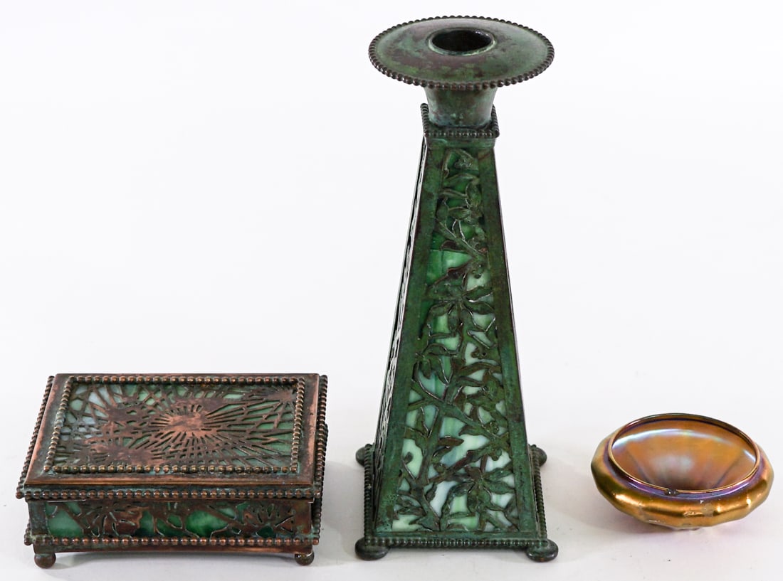 Metalworks/Glass (3) Tiffany Trinket Box & More: Group or metalworks items. AS-IS. Includes: Tiffany 4.5 x 3.5 x 1.5 in. covered box (glass cracked underside); iridescent table salt (chip to rim); 8 in. tall candleholder. Lot measures 8 in. H x 7 in