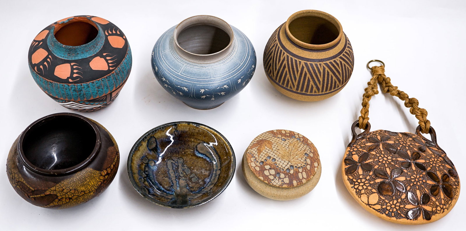 A Group of Assorted Studio Pottery: Items measure 2.5 x 5 inches to 5 x 6.25 inches. One piece has rim chips. Lot measures 18 in. H x 14 in. W x14 in. D for shipping purposes only. The absence of a condition report does not imply that
