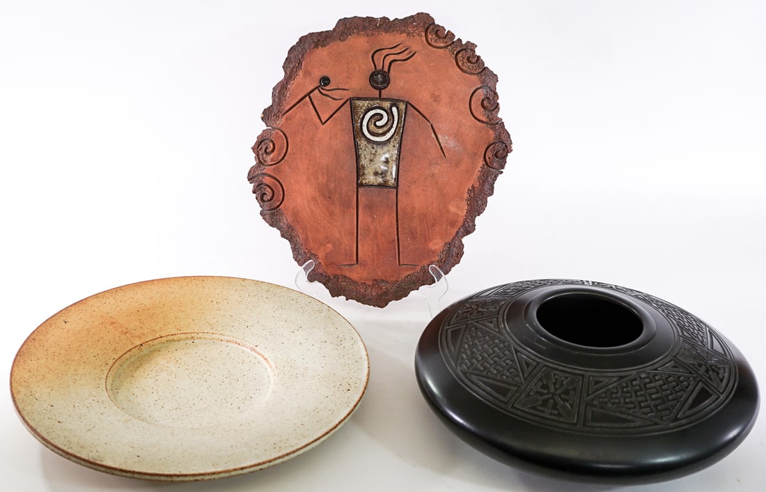 Pottery Plaque, Plate and Vase SIGNED: Studio Plaque is signed 'Mellow Mud 2005' and measures 13 x 12 in. Vase is signed 'Greenbaum' and measures 4.5 in. tall x 12.5 in. diameter. Plate measures 13.75 in. diameter. Lot measures 6.5 in. H