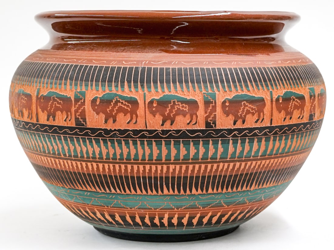 Ella Cadman Navajo Pottery Vase [Buffalo]: Ella Cadman (Navajo) large hand etched buffalo motif pottery pot urn. Measures 10 in. tall x 13 in. diameter. Measures 11.75 in. across rim. No evident cracks, chips or repairs. Lot measures 10 in. H
