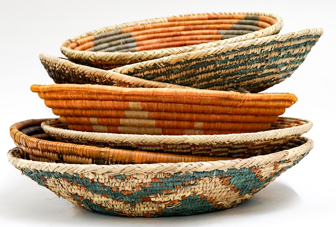 Woven (7) Baskets: Woven (7) basketry items. Lot measures 10 in. H x 16.5 in. W x 16.5 in. D for shipping purposes only. The absence of a condition report does not imply that the lot is in perfect condition or