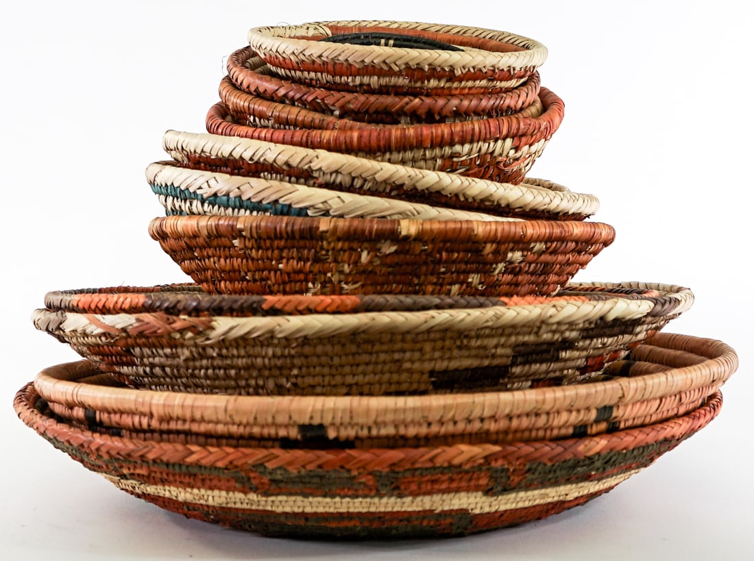 Woven (13) Baskets: Woven (13) basketry items. Lot measures 10 in. H x 13.5 in. W x 13.5 in. D for shipping purposes only. The absence of a condition report does not imply that the lot is in perfect condition or