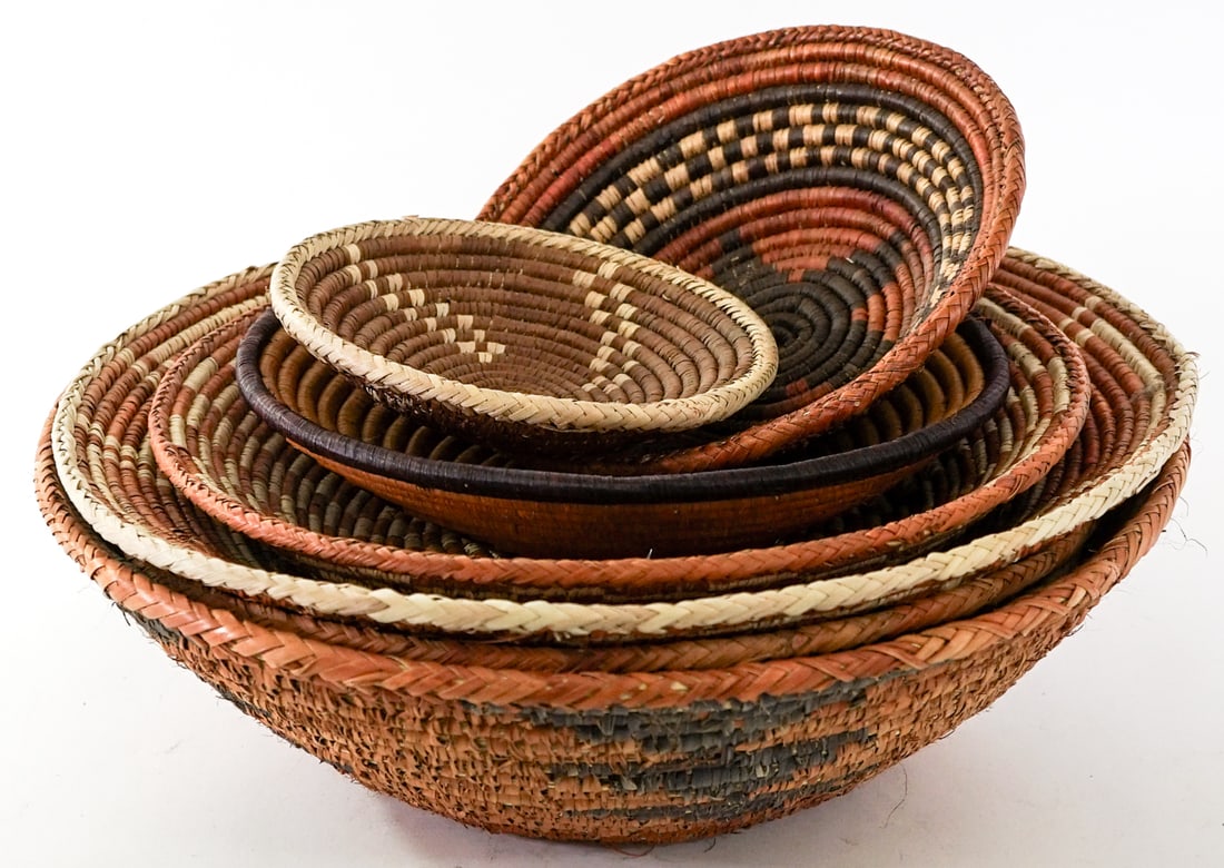 Group of Woven Baskets [8].: Group of Woven Baskets [8]. Lot measures 7 in. H x 18 in. W x 18 in. D for shipping purposes only. The absence of a condition report does not imply that the lot is in perfect condition or completely