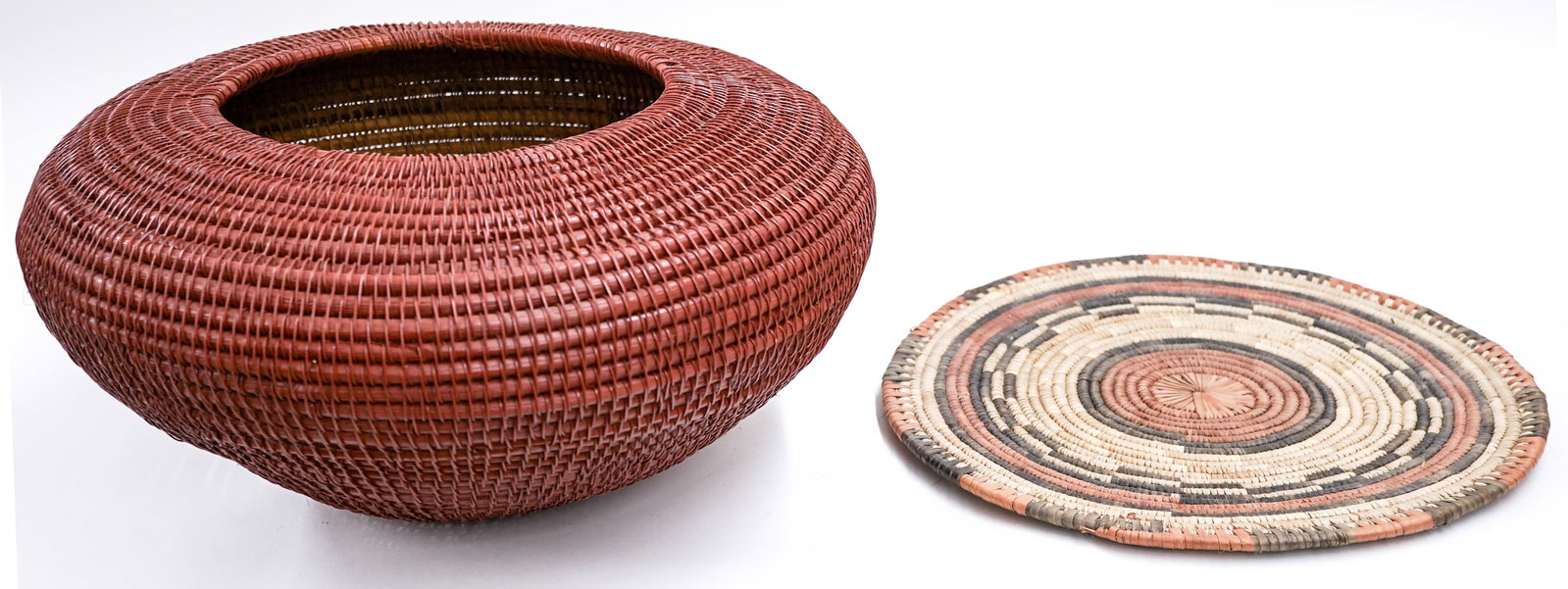 Basketry (2) Items: Lot measures 9 in. H x 17 in. W x 17 in. D for shipping purposes only. The absence of a condition report does not imply that the lot is in perfect condition or completely free from wear and tear,