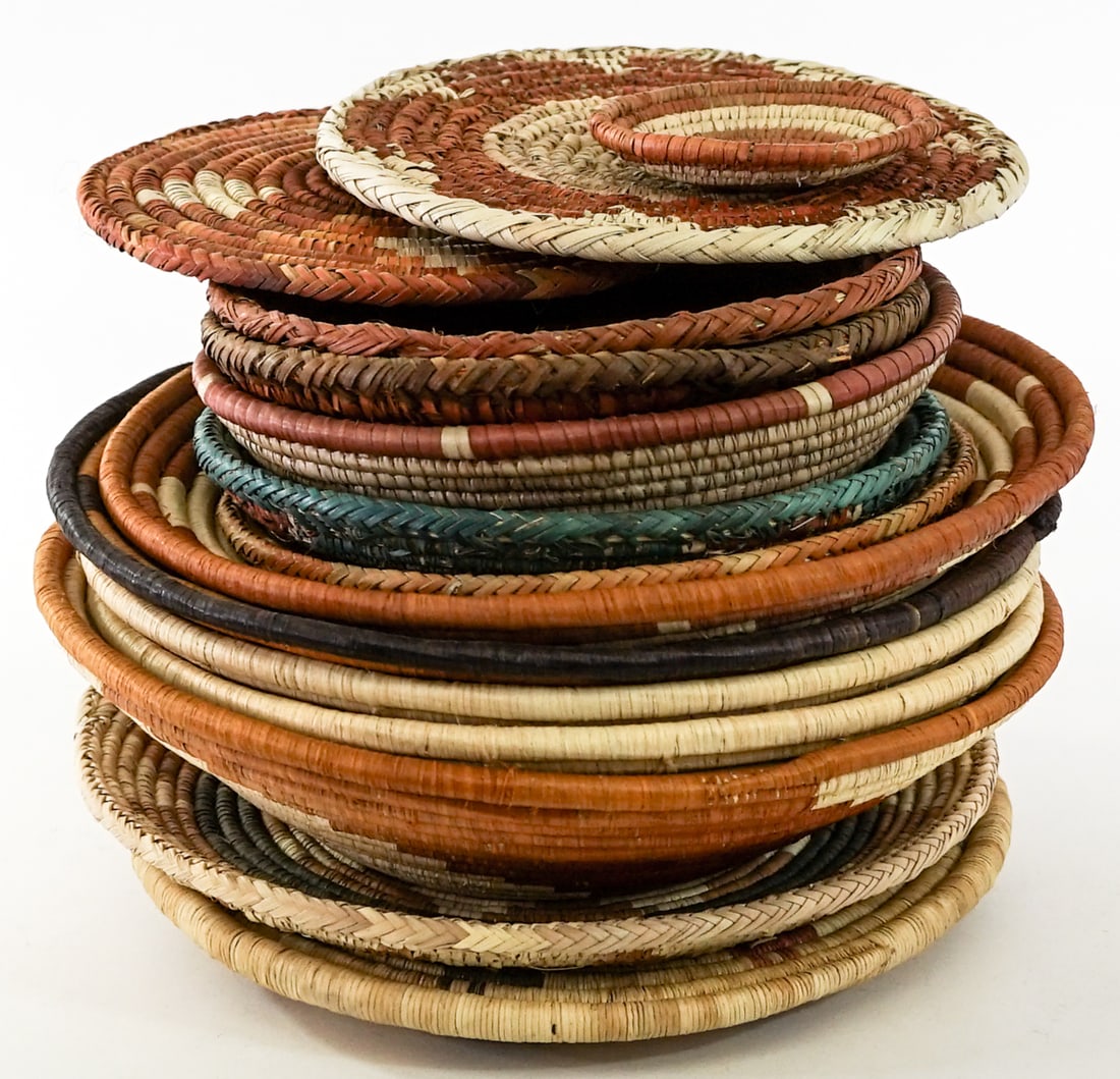 Group of Woven Baskets [15].: Group of Woven Baskets [15]. Lot measures 9.5 in. H x 12.75 in. W x 12.75 in. D for shipping purposes only. The absence of a condition report does not imply that the lot is in perfect condition or