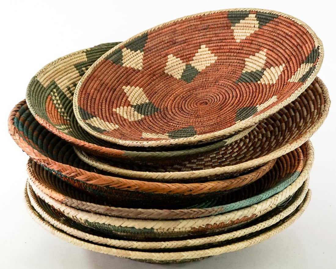 Group of Woven Baskets [8].: Group of Woven Baskets [8]. Lot measures 7.5 in. H x 16 in. W x 16 in. D for shipping purposes only. The absence of a condition report does not imply that the lot is in perfect condition or
