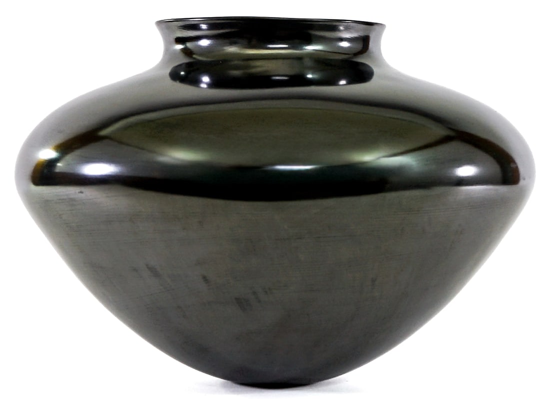 Illegibly Signed Pottery 8IN Vase: Pottery vase measures 8 in. tall x 11 in. diameter. No evident cracks, chips or repairs. Lot measures 8 in. H x 11 in. W x 11 in. D for shipping purposes only. The absence of a condition report does