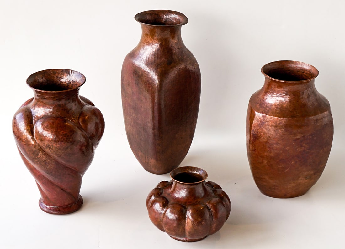 Four Hammered Copper Vases: They measure 3.25 to 9.25 inches tall. For shipping purposes the lot measures 14 x 10 x 10 inches. Excellent condition. The absence of a condition report does not imply that the lot is in perfect cond