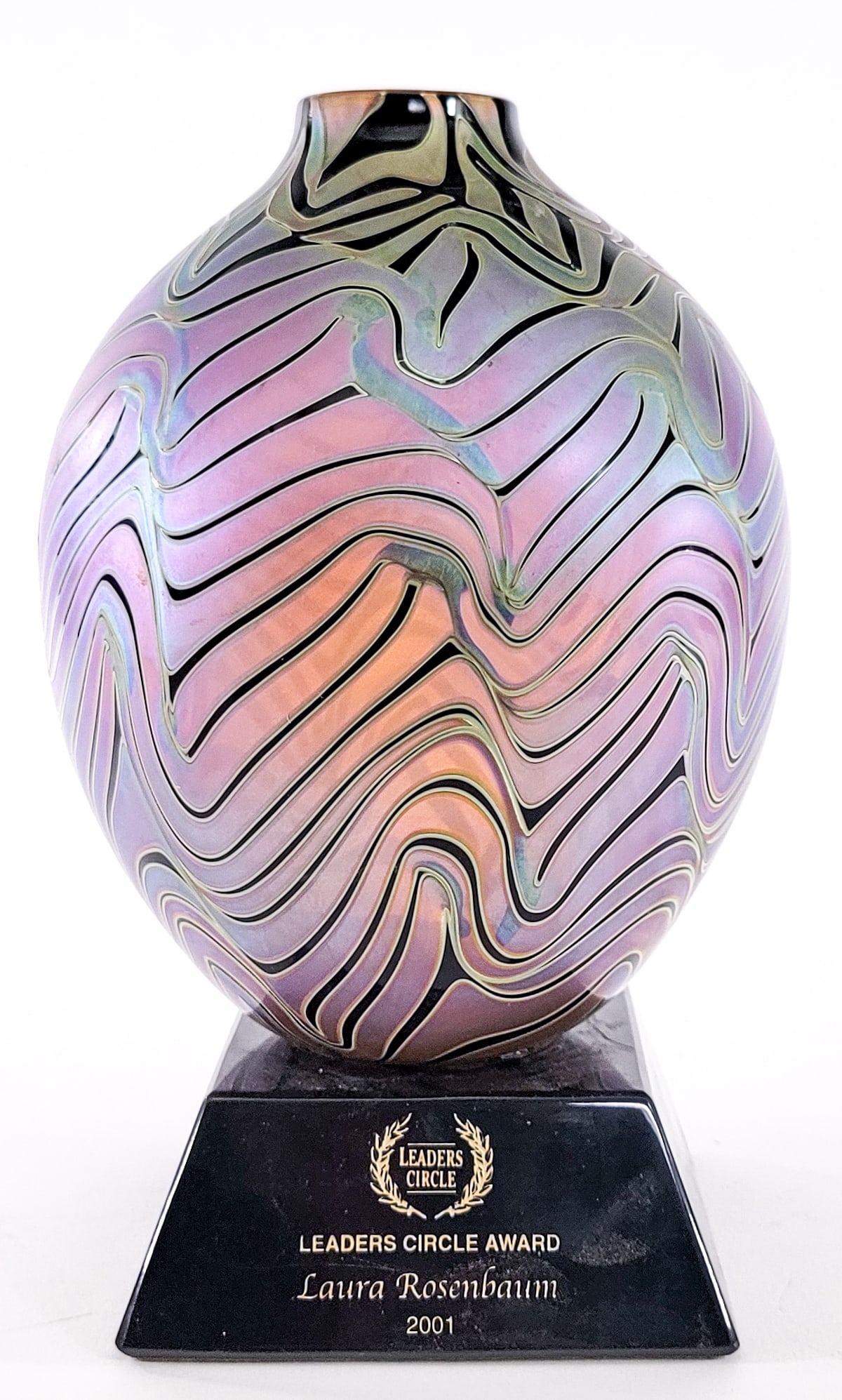 Art Glass Vase w/ Stand [Award]: Vase measures approximately 8 in. tall and is affixed to an award platform. No evident cracks, chips or repairs. Lot measures 9.5 in. H x 5.5 in. W x 5.5 in. D for shipping purposes only. The absence 