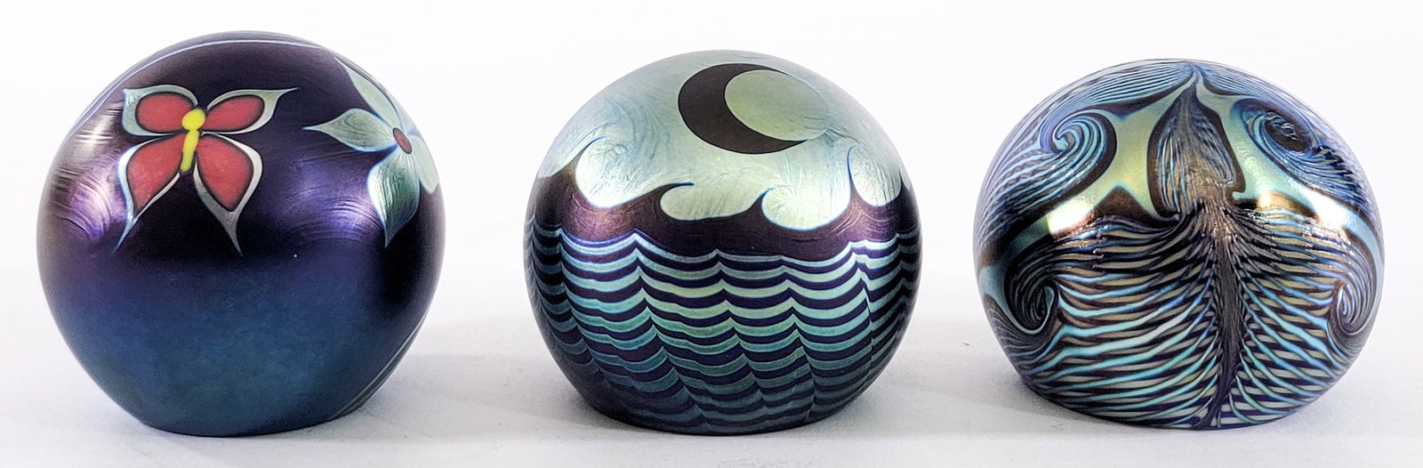 Steven Correia (3) Paperweights SIGNED [Moon]: Three (3) Steven Correia signed paperweights. Measure 2.625 to 3 in. tall. No evident cracks, chips or repairs. Lot measures 3 in. H x 3 in. W x 9 in. D for shipping purposes only. The absence of a