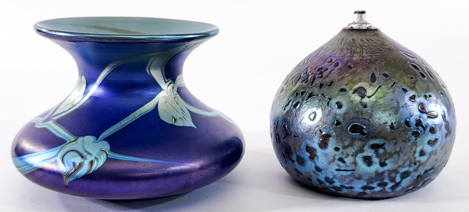 Art Glass (2) Vase / Oil Lamp [Richard Goulding]: Includes: Richard Goulding SIGNED Okra Glass vase measures 3.5 in. tall x 5 in. diameter; Philbalm SIGNED oil lamp measures 3.75 in. tall x 4 in. diameter. No evident cracks, chips or repairs. Lot mea