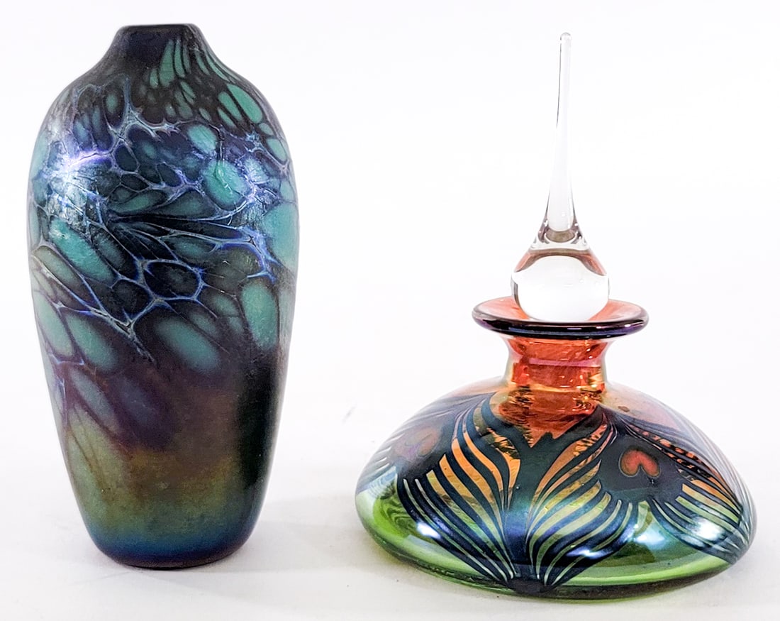 Art Glass (2) Items [Robert Held; Maytum Studios]: Includes: Robert Held SIGNED ' heart' perfume bottle measures 6 in. tall (with dauber 6 in. tall); Maytum Studios vase measures 6.5 in. tall No evident cracks, chips or repairs. Lot measures 6.5 in. H