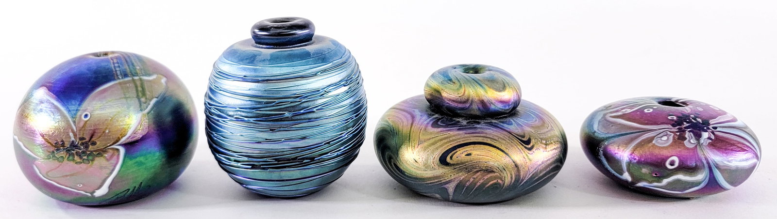 Art Glass (4) Oil Lamps / Perfume [Glasshouse]: Artists include: Glasshouse; Eickholt; and others. Measure 1.75 in. to 3.5 in. tall. No evident cracks, chips or repairs. Lot measures 3.5 in. H x 8 in. W x 8 in. D for shipping purposes only. The abs