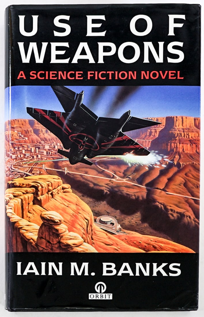 Use of Weapons by Iain M. Banks SIGNED 1ST UK: Use of Weapons by Iain M. Banks signed on title page. Orbit 1990 1st Great Britain with unclipped dust jacket. 371 + 3 pp. Black covers. Very light bump to front top corner. Lot measures 9.5 in. H x 6