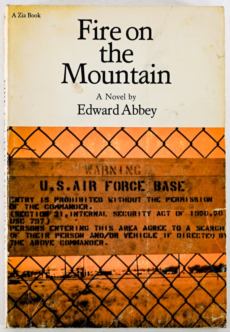 Fire on the Mountain by Edward Abbey SIGNED 1978: SOFTCOVER Fire on the Mountain by Edward Abbey signed on half title page. 1978 University of New Mexico Press. Lot measures 8 in. H x 5.5 in. W x .75 in. D for shipping purposes only. The absence of a