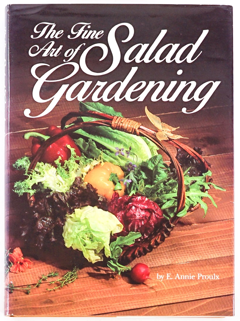 The Fine Art of Salad Gardening by Proulx SIGNED: The Fine Art of Salad Gardening by E. Annie Proulx signed on title page. Rodale Press 1985 with unclipped dust jacket. 210 pp. Orange covers. Lot measures 9.5 in. H x 7 in. W x 1 in. D for shipping pu