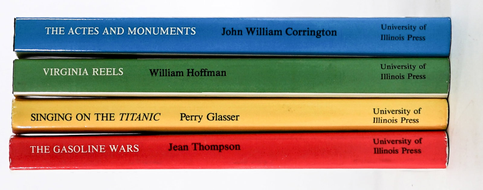 SCARCE (4) University of Illinois Published Books: 1) The Gasoline Wars by Jean Thompson SIGNED. 2) The Actes and Monuments by John William Corrington. 3) Virginia Reels by William Hoffman. 4) Singing on the Titanic by Perry Glasser. Lot measures 8.25