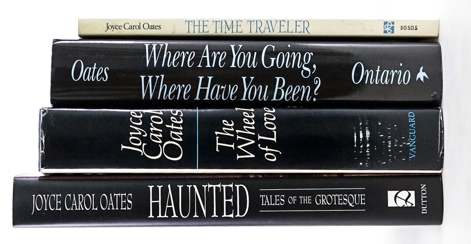 Joyce Carol Oates (4) Books (3 SIGNED): 1) The Time Traveler Poems softcover 1st. 2) The Wheel of Love 1970 SIGNED. 3) The Haunted 1994 1st SIGNED. 4) Where are You Going, Where Have You Been? 1993 1st SIGNED. Lot measures 9.5 in. H x 6.5 i