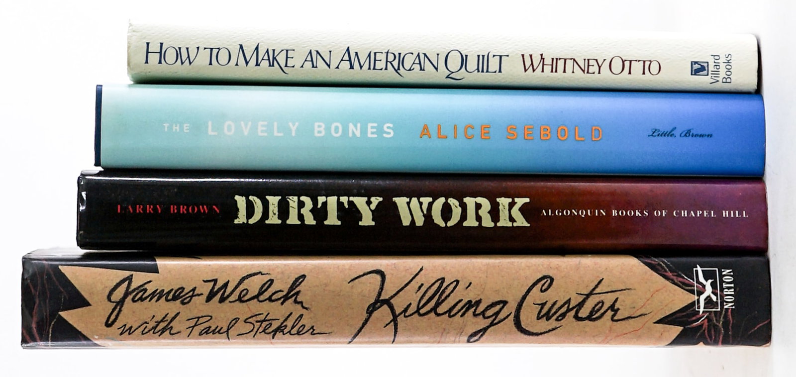 Author Signed (4) Novels: Four (4) author signed novels include: Killing Custer by James Welch; How to Make an American Quilt by Whitney Otto; Dirty Work by Larry Brown; The Lovely Bones by Alice Sebold. Lot measures 9.5 in. H