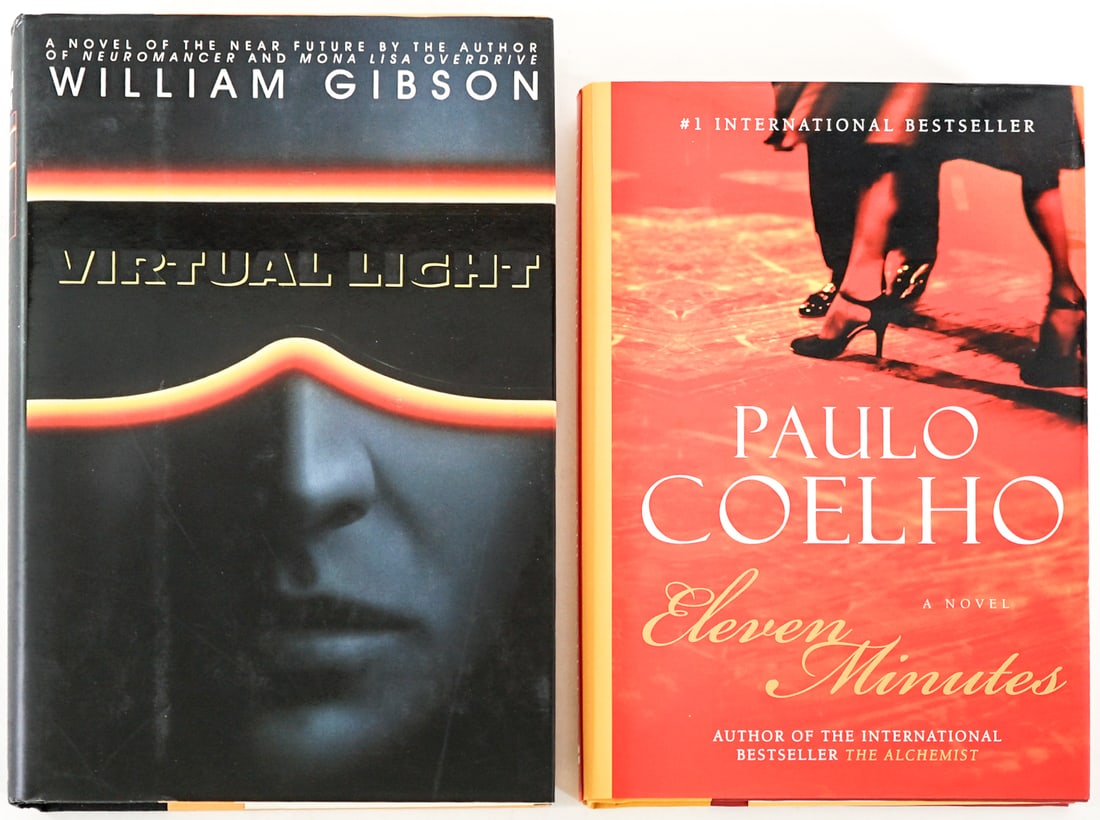 Author SIGNED (2) Books [Paulo Coelho]: 1) Virtual Light by William Gibson. Bantam 1993 with unclipped dust jacket. 2) Eleven Minutes by Paulo Coelho. Harper Collins 1st U.S. with unclipped dust jacket. Lot measures 9.25 in. H x 6.25 in. W