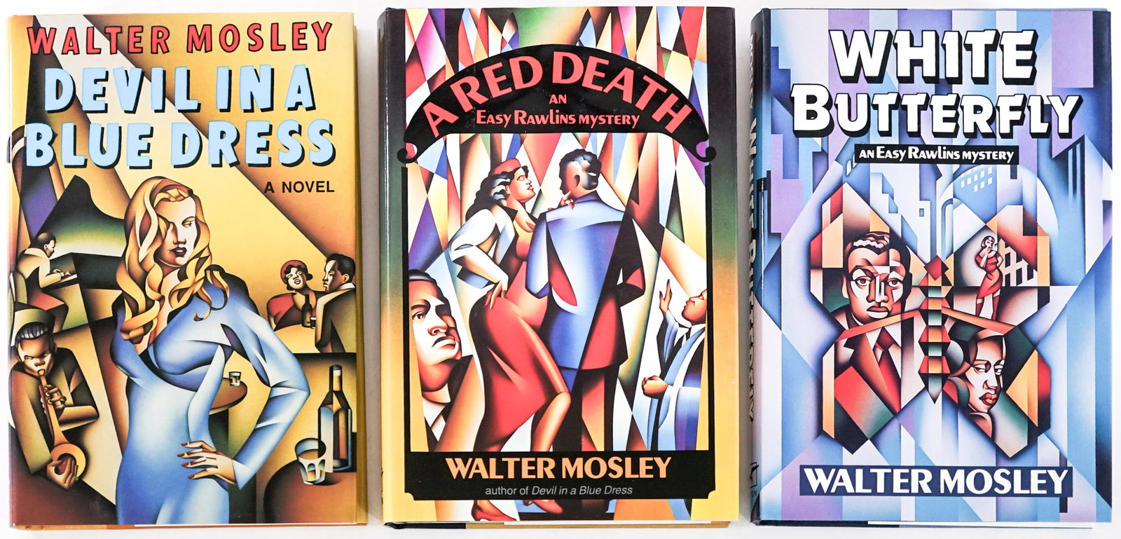 Walter Mosley (3) SIGNED 1st Edition Books: Three (3) Norton 1st editions with unclipped dust jackets all author signed on title pages. Include White Butterfly; Devil in a Blue Dress and a Red Death. Lot measures 8.5 in. H x 5.75 in. W x 3 in. 