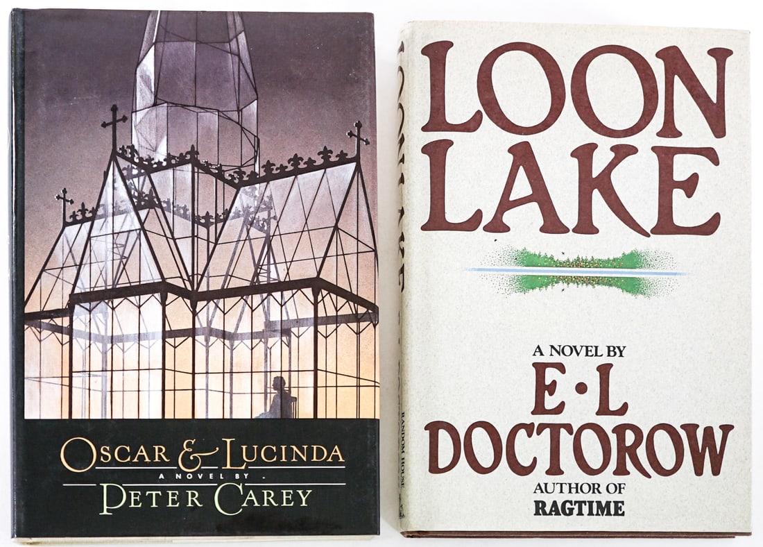 First US Editions (2) Books [1 SIGNED]: 1) Oscar and Lucinda by Peter Carey signed with inscription on title page. Harper and Row 1988 with unclipped dust jacket. 2) Loon Lake by E L Doctorow. Random House 1980 with unclipped dust jacket. L