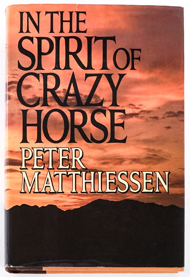 In the Spirit of Crazy Horse by Mathiessen SIGNED: In the Spirit of Crazy Horse by Peter Mathiessen signed with inscription. Viking 1983 with unclipped dust jacket. Owner name inside front cover. Two-tone covers. Lot measures 9.5 in. H x 6.5 in. W x 2