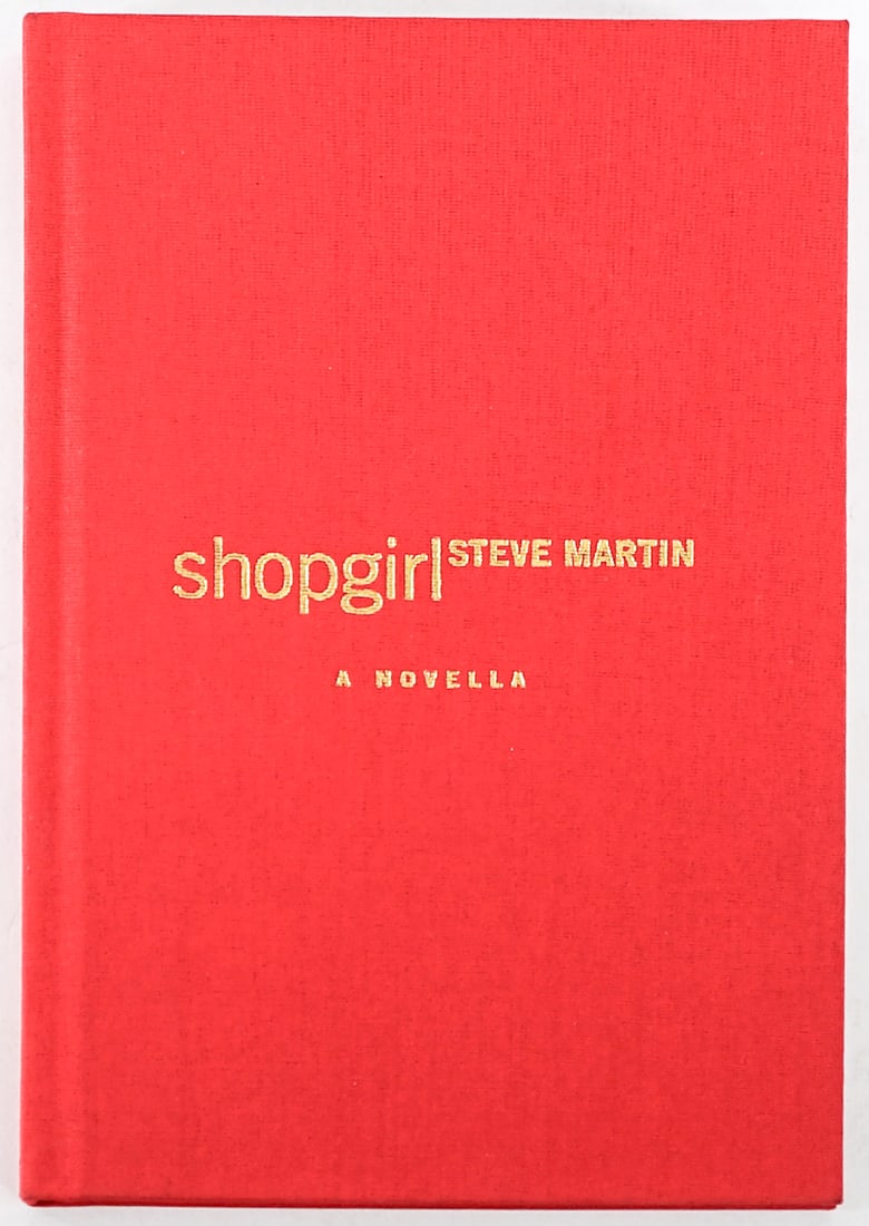 Shopgirl by Steve Martin SIGNED: Shopgirl by Steve Martin signed. 2000 advance copy. Red cloth covers. Lot measures 8.5 in. H x 6 in. W x 1.75 in. D for shipping purposes only. The absence of a condition report does not imply that th