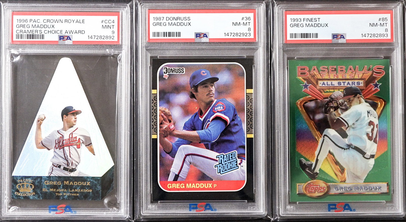 (3) Greg Maddux Graded Cards: 1) 1993 Finest #85 PSA 8. 2) 1987 Donruss #36 PSA 8. 3) 1986 Pac. Crown Royale Cramer's Choice Award #CC4 PSA 9. Lot measures 5.5 x 3.5 x .75 inches for shipping purposes. The absence of a condition
