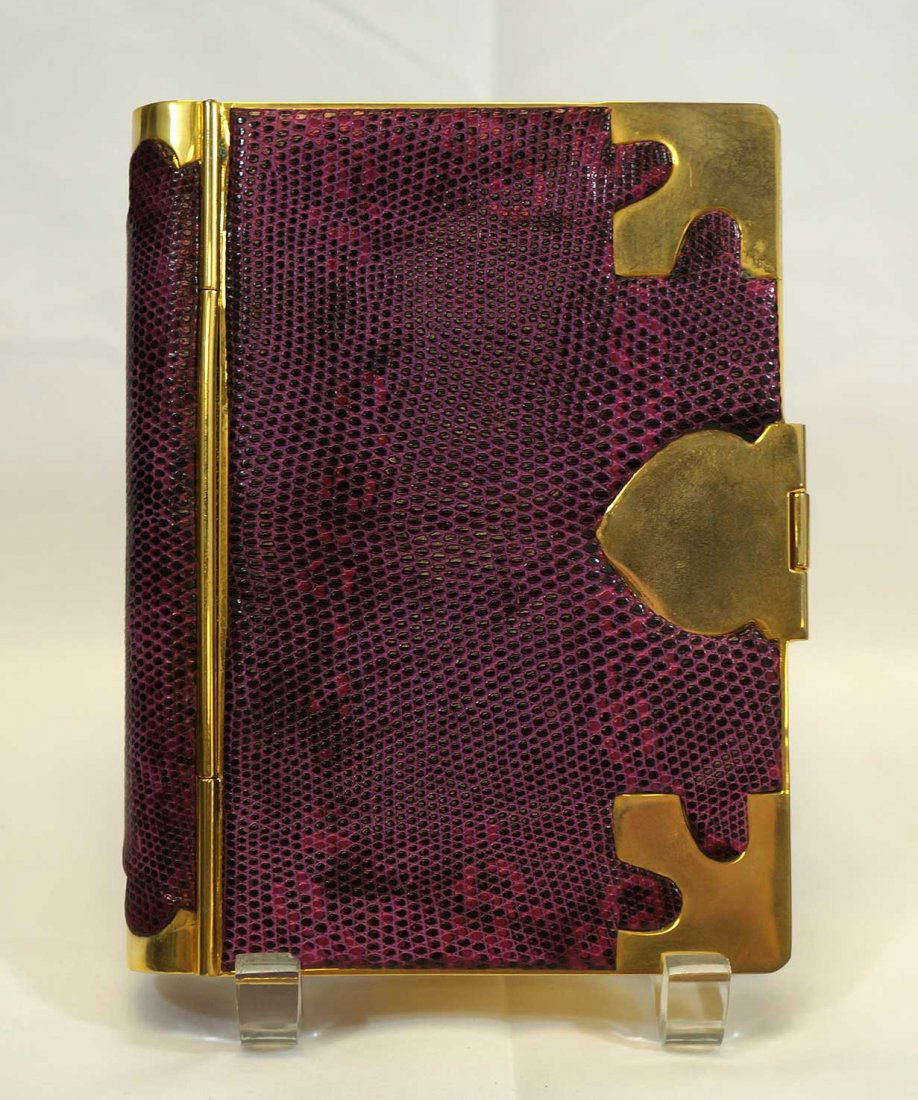 Judith Leiber Snakeskin Book Minaudiere: 7" x 5.5", , excellent condition with chain. Guaranteed authentic. From the collection of Alan and Pat Rypinski.