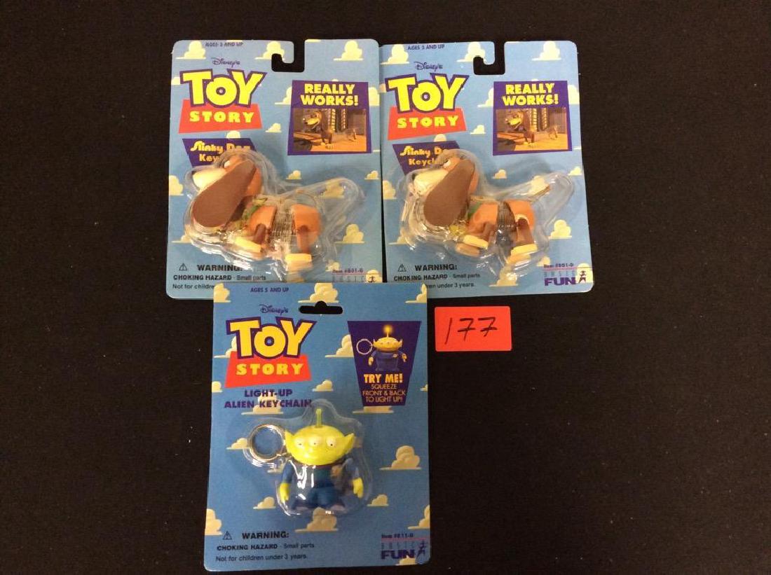 VINTAGE ORIGINAL TOY STORY KEYCHAINS. TWO SLINKY DOGS (1 of 2)