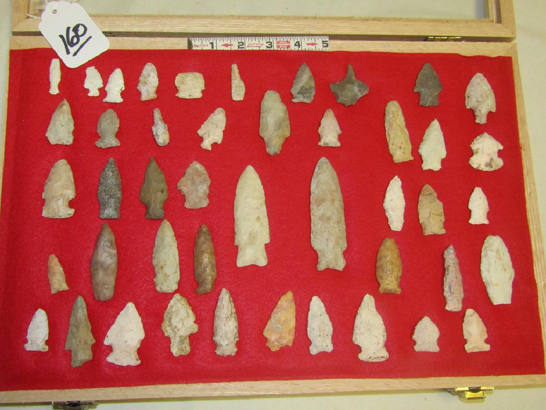 45 points: Wood display with 45 various flint points and tools